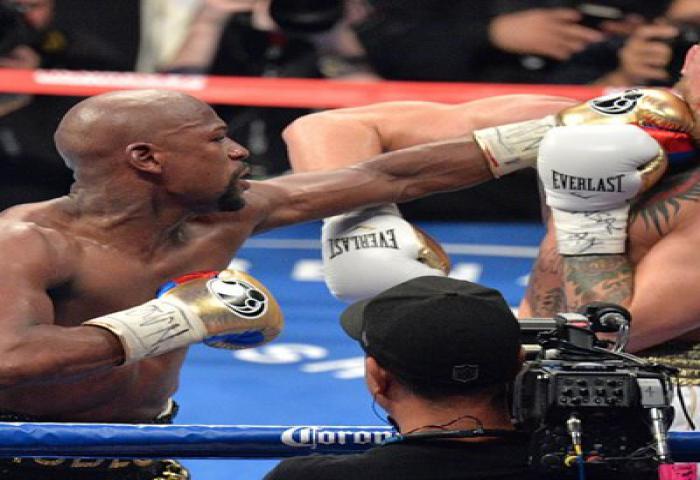 Floyd Mayweather Kalahkan Conor McGregor